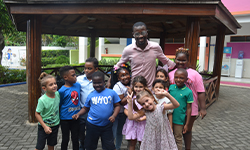 A diverse group of students learning together in a bright setting